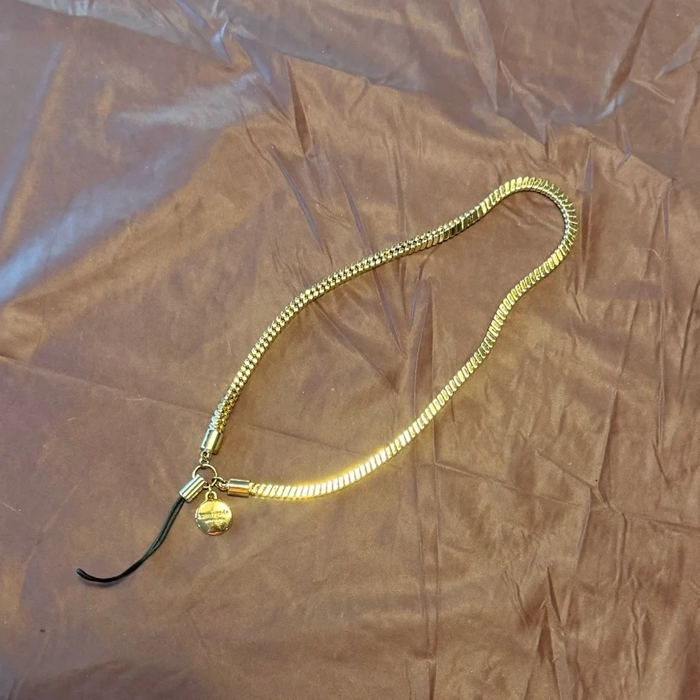 kate spade Gold Tone Phone Wrist Strap with Black Cord Loop